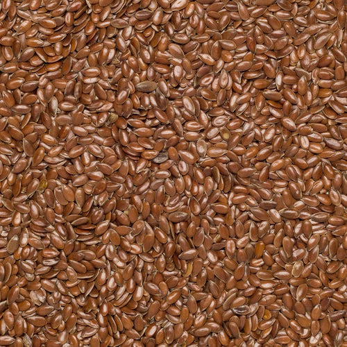 Close up of brown organic flax seeds.